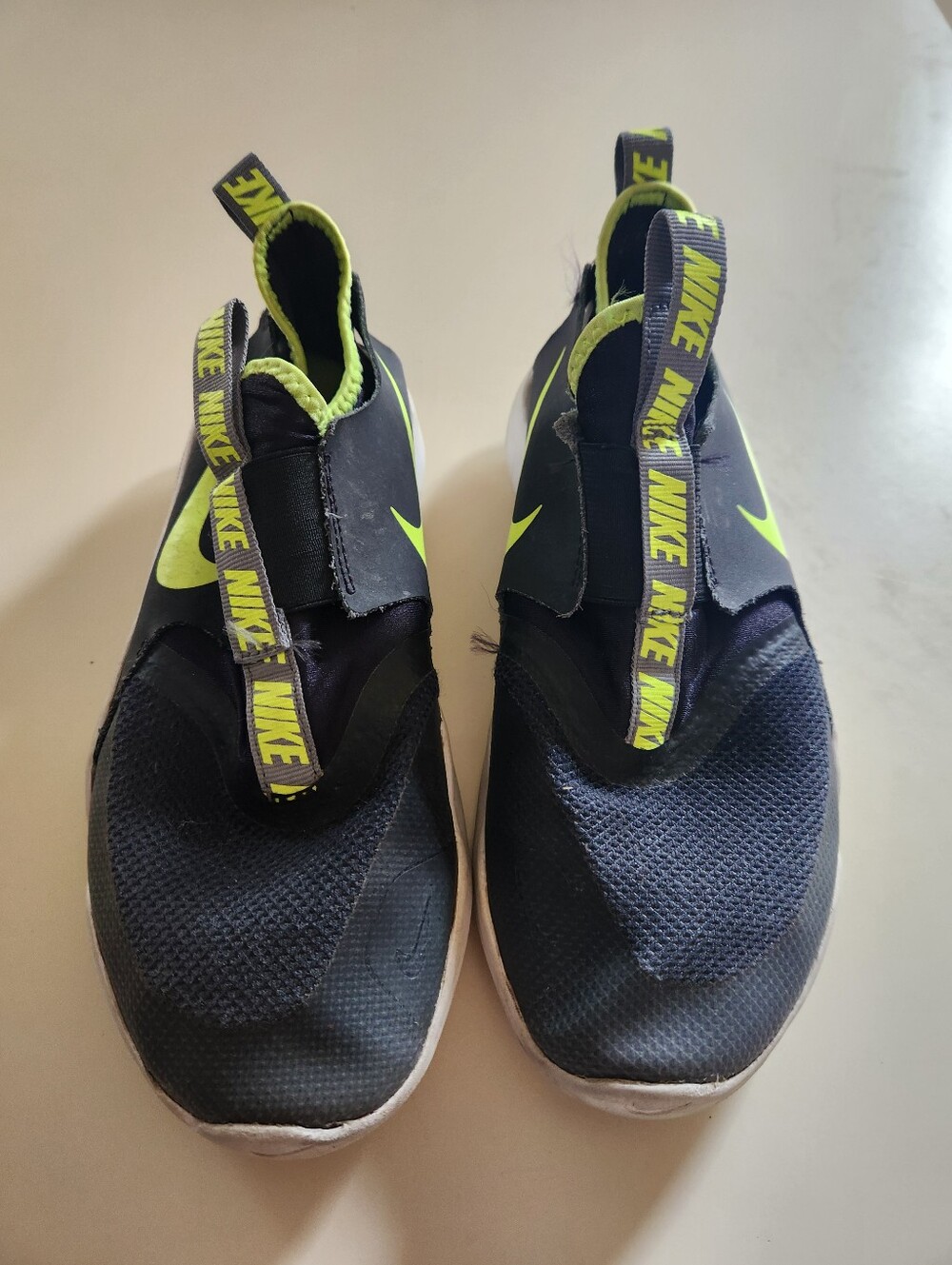Nike Kids Slip-On Sneakers in Black and Volt Green